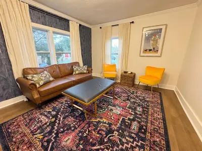 a living room with a couch and a rug at Dreami Stays Panama City - 2BR Retreat Near Downtown, Beaches, & Hot Spots in Panama City