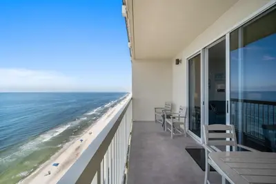a balcony with chairs and a view of the beach at Celadon Beach 2107 in Panama City Beach