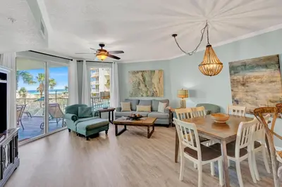 a living room with a table and a couch at Dunes of Seagrove 106A in Santa Rosa Beach