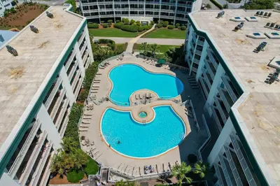 an overhead view of a swimming pool between two buildings at Dunes of Seagrove 106A in Santa Rosa Beach