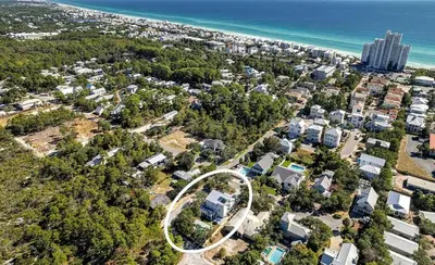 an aerial view of a city with a circle at 10 Joanna Sophisticated Seagrove Beach pool sleeps 14 in Santa Rosa Beach