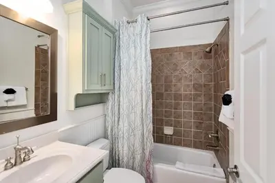 a bathroom with a sink and a toilet and a shower at Seagrove Retreat - Steps to Beach, Pool, and Seaside in Santa Rosa Beach