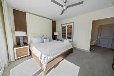 a bedroom with a bed and a ceiling fan at The Pointe at Rosemary Beach 332 in Rosemary Beach