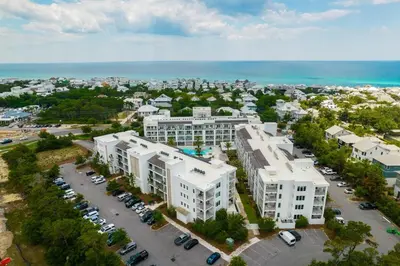 an aerial view of a city with white buildings and a parking lot at The Pointe at Rosemary Beach 332 in Rosemary Beach