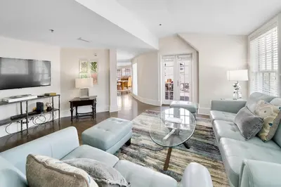 a living room with a couch and a table at Rosemary Beach 5 Main St 1F in Rosemary Beach