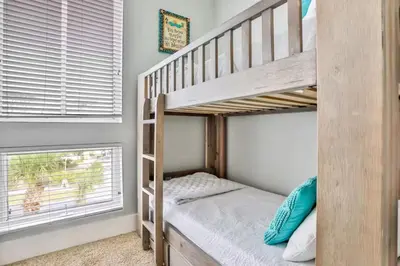 a bedroom with bunk beds and a window at Palazzo 30A in Santa Rosa Beach