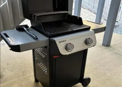 a black and white barbecue grill sitting on a table at Palm Sounds in Inlet Beach