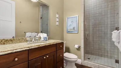 a bathroom with a sink and a toilet and a shower at 448 Beach Bike Way in Rosemary Beach