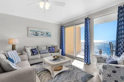 a living room with a couch and a table at Treasure Island Unit 905 (2/2) in Panama City Beach