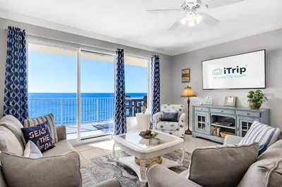 a living room with a view of the ocean at Treasure Island Unit 905 (2/2) in Panama City Beach