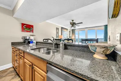 a kitchen with a sink and a counter top at Dunes of Panama 1104E in Panama City Beach