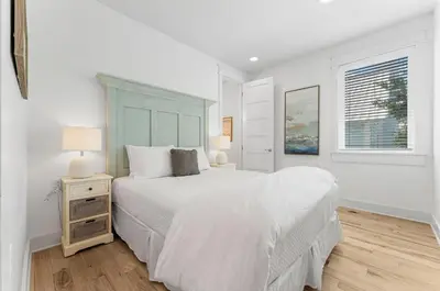a white bedroom with a large bed and a window at Available for Season! Hi Beautiful Ciao Bella at Seacrest in Inlet Beach