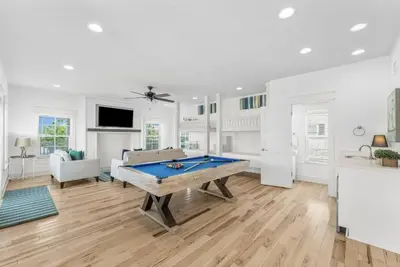 a living room with a pool table in it at Available for Season! Hi Beautiful Ciao Bella at Seacrest in Inlet Beach