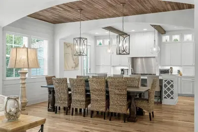 a kitchen and dining room with a table and chairs at Available for Season! Hi Beautiful Ciao Bella at Seacrest in Inlet Beach