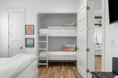 a bedroom with two bunk beds and a closet at Available for Season! Hi Beautiful Ciao Bella at Seacrest in Inlet Beach