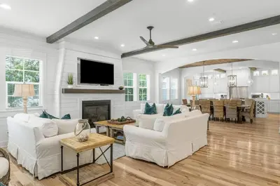 a living room with white furniture and a fireplace at Available for Season! Hi Beautiful Ciao Bella at Seacrest in Inlet Beach