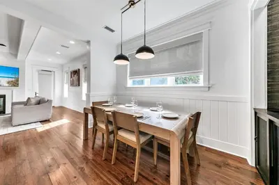a dining room with a table and chairs at Available for Season! After Dune Delight at Nature Walk in Santa Rosa Beach