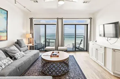 a living room with a couch and a table at Available for Season! One Life One Love Gulf-Front Townhome in Seagrove Beach
