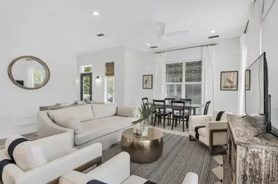 a living room with white furniture and a table at Available for Season! Seagrove Harbor 30A - Private Pool in Seagrove Beach