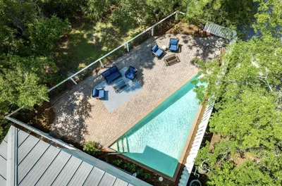 an overhead view of a pool with chairs and a fence at Available for Season! Seagrove Harbor 30A - Private Pool in Seagrove Beach