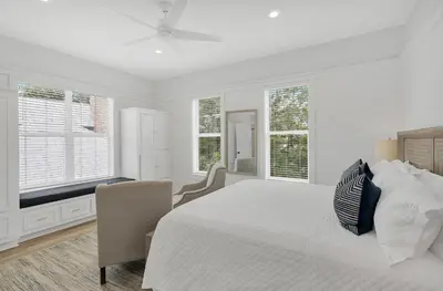 a white bedroom with a large bed and windows at Available for Season! Seagrove Harbor 30A - Private Pool in Seagrove Beach