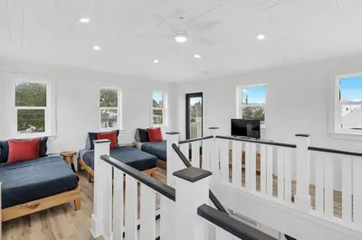a white living room with two couches and a tv at Available for Season! Seagrove Harbor 30A - Private Pool in Seagrove Beach