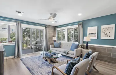 a living room with a couch and a table at Available for Season! Sand Castle at Seagrove Beach in Santa Rosa Beach