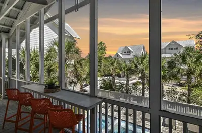 a view from the balcony of a resort with a table and chairs at Available for Season! Sand Castle at Seagrove Beach in Santa Rosa Beach