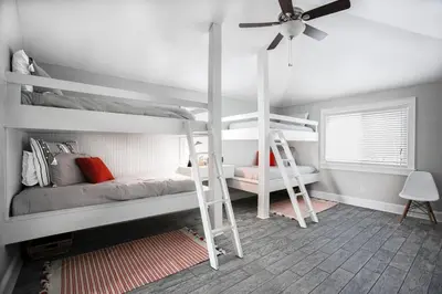 a bedroom with two bunk beds and a ceiling fan at You've Hit The Vacay Jackpot with This Sure Winner! in Rosemary Beach