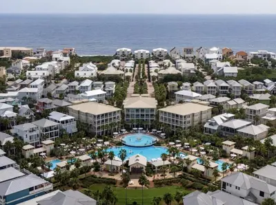 an aerial view of a resort with a pool and the ocean at Available for Season. Gone Coastal at Seacrest in Inlet Beach