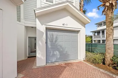 a garage door with the number on it at Seacrest Beach Gem with Shared Pool and Game Room in Seacrest
