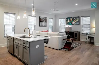 a kitchen and living room with a couch and a sink at R3 at Inlet Beach with Pool Access and EV Connector - Walk to Beach in Inlet Beach