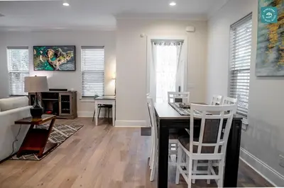 a kitchen and living room with a table and chairs at R3 at Inlet Beach with Pool Access and EV Connector - Walk to Beach in Inlet Beach