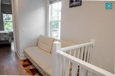 a white couch in a room with two windows at R3 at Inlet Beach with Pool Access and EV Connector - Walk to Beach in Inlet Beach
