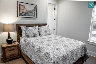 a bedroom with a bed and a lamp on a night stand at R3 at Inlet Beach with Pool Access and EV Connector - Walk to Beach in Inlet Beach