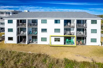 a large white building with balconies on a beach at Gulf Front, Seagrove Beach, Sleeps 6, 1st floor, private beach access!! in Seagrove Beach