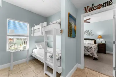 a bedroom with two bunk beds and a bed at Laketown Wharf #1232 in Panama City Beach
