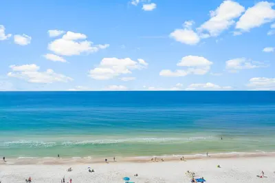 a group of people on a beach near the ocean at Celadon #0808 in Panama City Beach