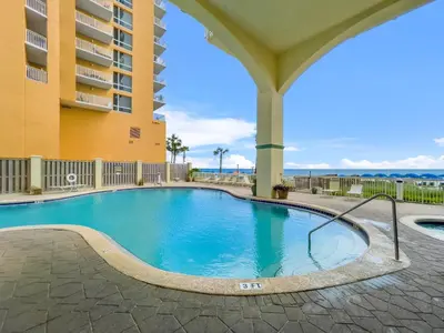 a swimming pool in front of a building at Celadon #0808 in Panama City Beach