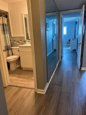 a bathroom with a toilet and a sink at Regency Towers #0307 in Panama City Beach