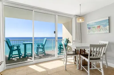 a dining room with a view of the ocean at Majestic Beach Towers #2-1203 in Panama City Beach