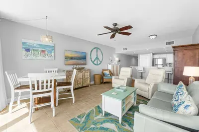 a living room with a couch and a table at Majestic Beach Towers #2-1203 in Panama City Beach