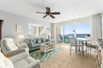 a living room with a couch and a table at Majestic Beach Towers #2-1203 in Panama City Beach