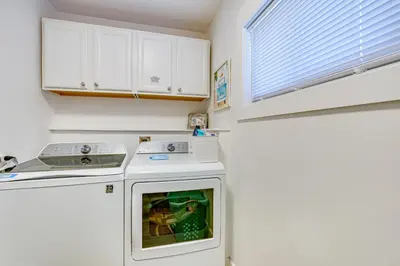 a kitchen with a stove and a dishwasher at Walk to Beach Chic PCB Getaway with Yard in Panama City Beach