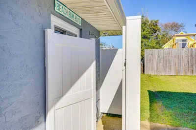 a white garage door with a sign on top at Walk to Beach Chic PCB Getaway with Yard in Panama City Beach