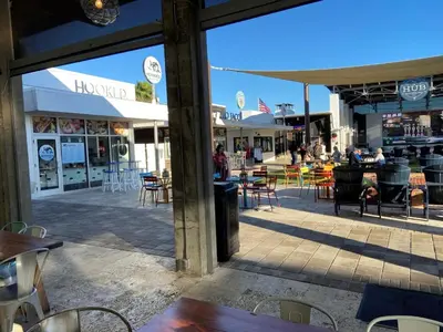 a view of a patio with tables and chairs at BIG EASY on 30A in Watersound Beach