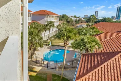 a view of a swimming pool from a balcony at Balconies with a View at Horizon South 54-302 in Panama City Beach