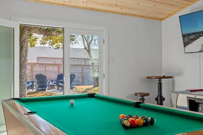 a billiard room with a pool table in a house at Casa Del Palms - Private Pool Home, Game Room, 2 Min Walk to Beach, Pets OK! in Panama City Beach