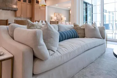 a white couch with pillows in a living room at Something Salty in Santa Rosa Beach