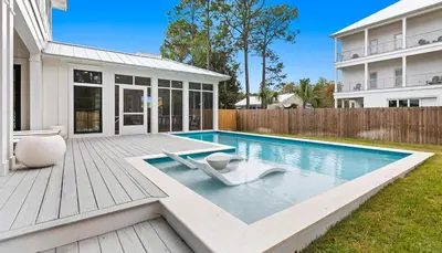 a swimming pool in the backyard of a house at Something Salty in Santa Rosa Beach